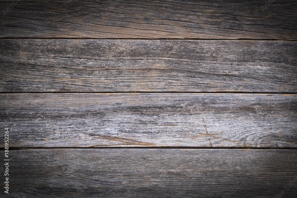 A rustic wooden background made of weathered boards A rustic wooden background made of weathered boards