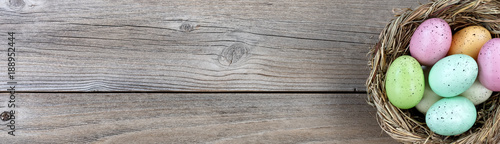 Natural bird nest and eggs on weathered wooden boards