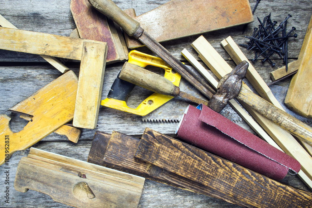 Old carpentry tools on a wooden table Old carpentry tools on a wooden table