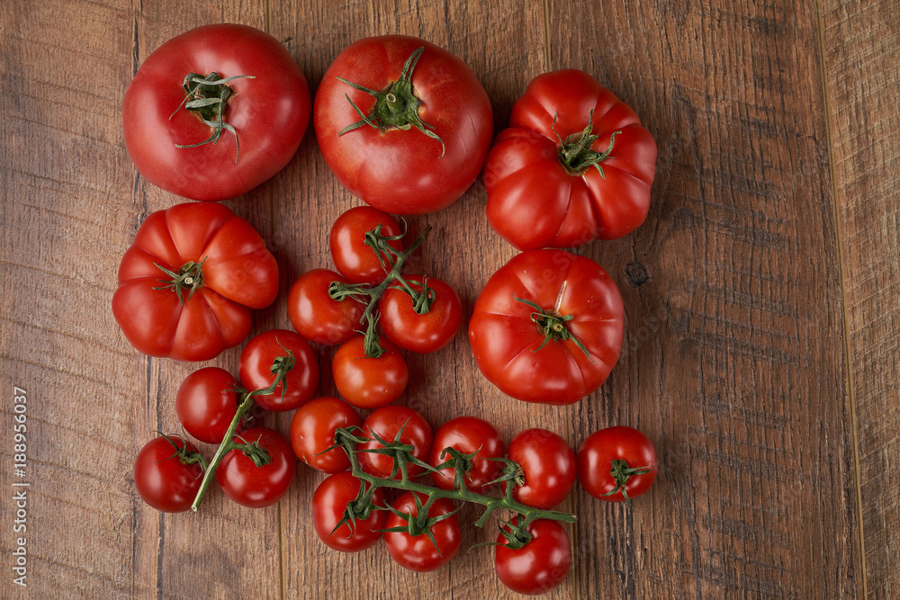 Tomatoes on the wooden background Tomatoes on the wooden background