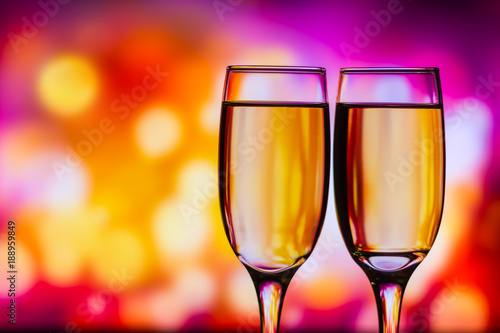 Two glasses of champagne on holiday bokeh background