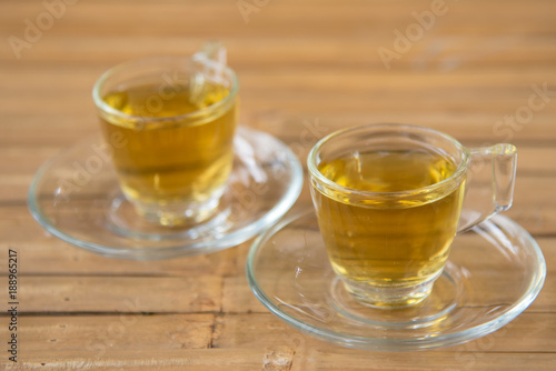 couple hot chinese tea in glass with wood background