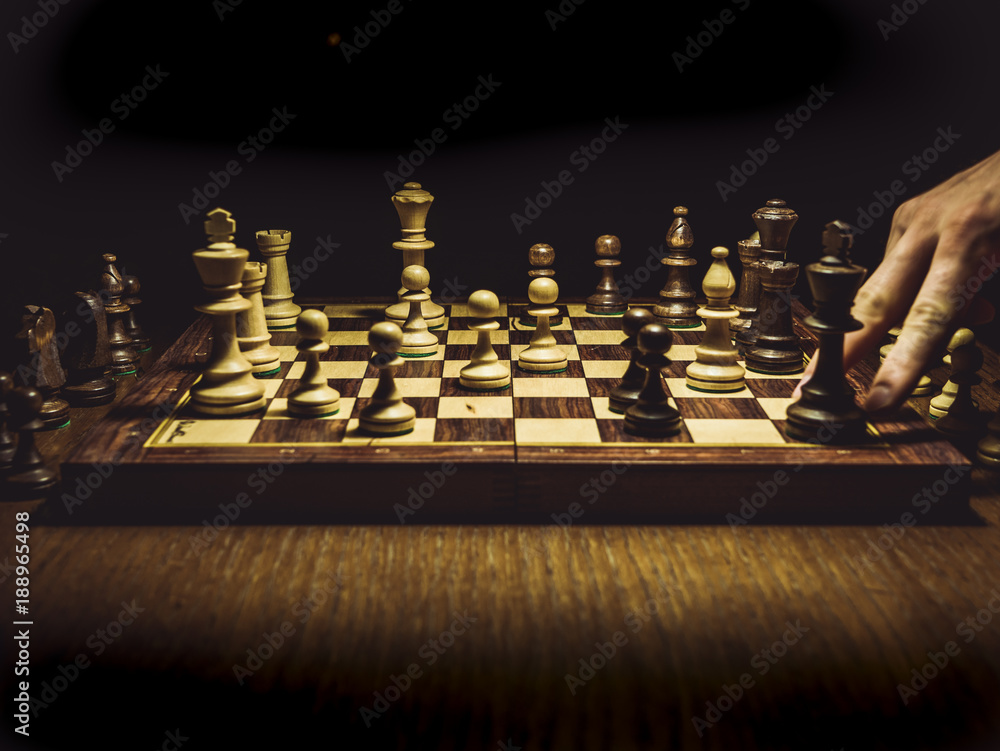 close up shot of the checkmate board with pieces isolated on the table close up shot of the checkmate board with pieces isolated on the table