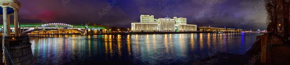 Bright panorama of night december pretty Pushkin Bridge and Defence Ministry, Moscow, Russia. Illuminated with sparks of christmas Moscow river
