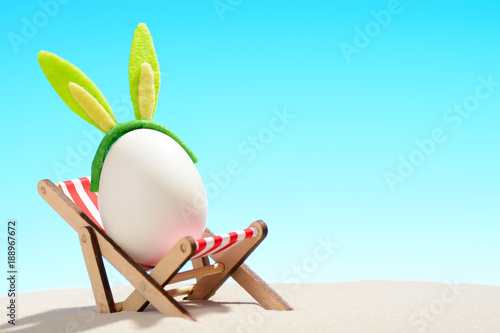 Egg in lounger on beach