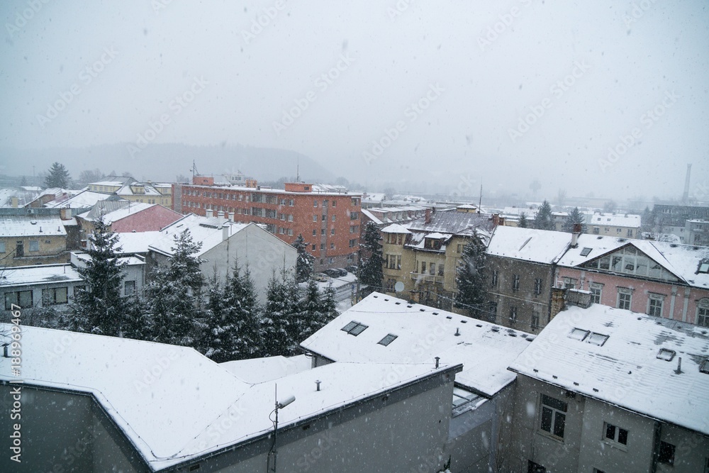 Fototapeta premium Snowfall in the town. Slovakia