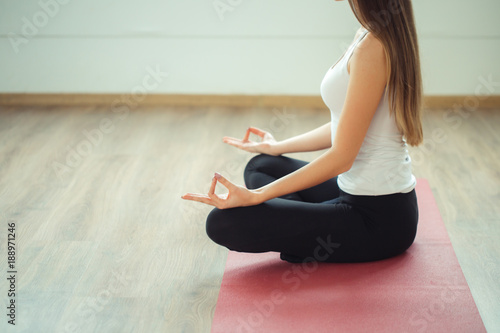 Young woman meditates while practicing yoga. Freedom concept photo