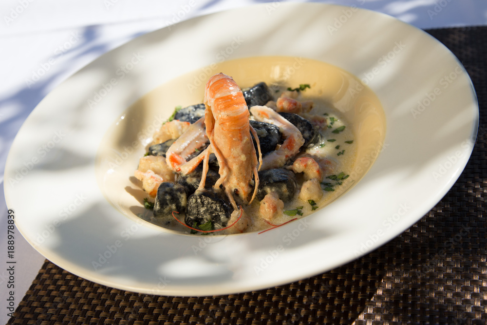Black sepia gnocchi with shrimps, Restaurant, Croatia Black sepia gnocchi with shrimps, Restaurant, Croatia