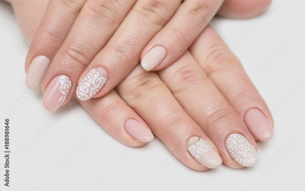 Manicure and white abstract pattern on women's nails Manicure and white abstract pattern on women's nails