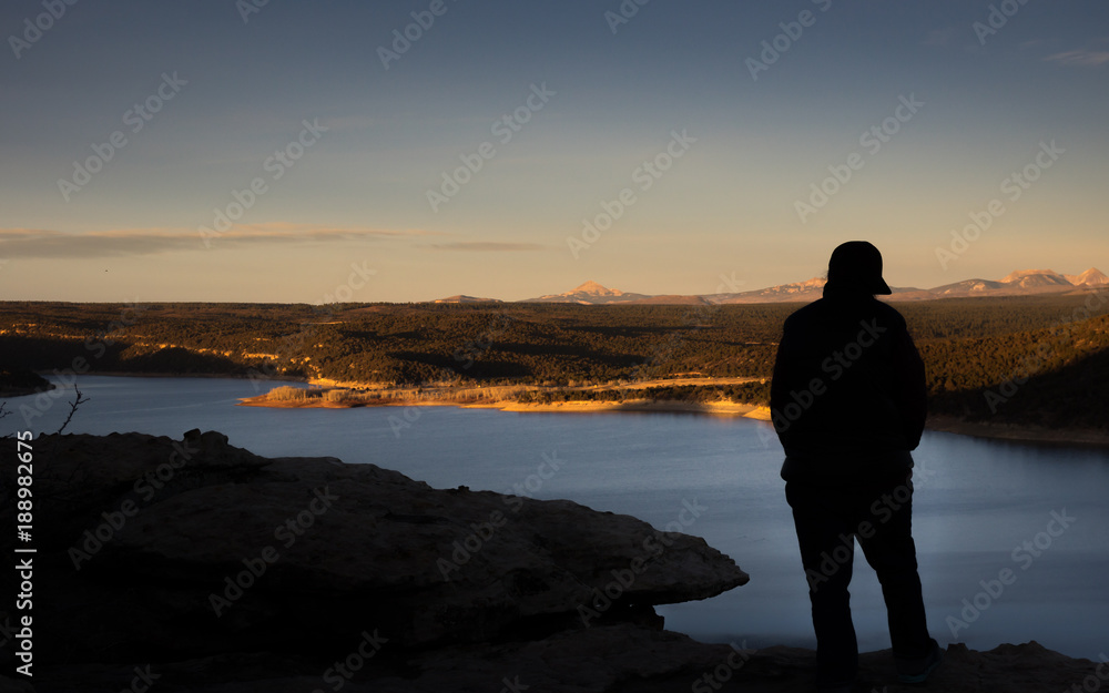Fototapeta premium Contemplating sunset over the lake