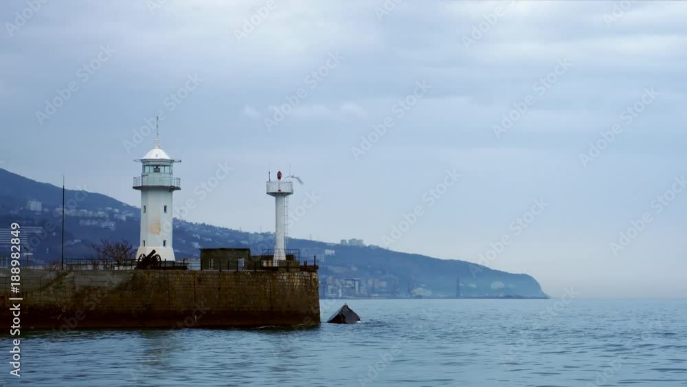 View of the lighthouse standing on the coast in Yalta, Crimea View of the lighthouse standing on the coast in Yalta, Crimea