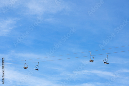 ski chair lift against blue sky