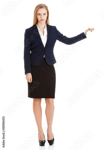 Beautiful caucasian business woman holding hand on empty space.