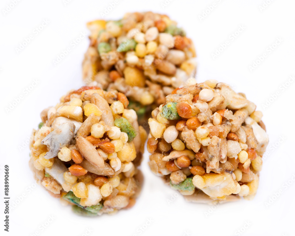 Garden veggie parrot food with carrots, peas and broccoli isolated on white background Garden veggie parrot food with carrots, peas and broccoli isolated on white background