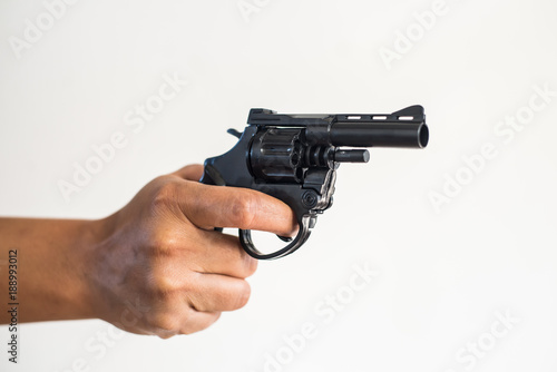 Hand shooting gun on white background.killer concept.