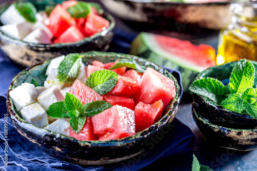 Watermelon cheese and mint salad with olive oil. Close up