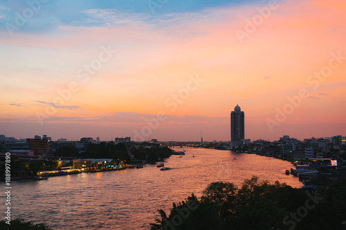 Cityscape of Bangkok chao phraya river in sunset.