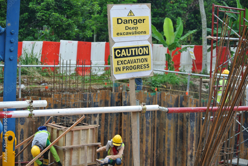 Safety signage "Danger Deep Excavation" at the construction site
