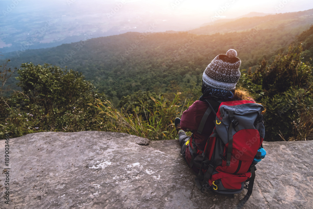 women asians travel relax in the holiday. Admire the atmosphere landscape on the Moutain. Mountain Park happily. In Thailand women asians travel relax in the holiday. Admire the atmosphere landscape on the Moutain. Mountain Park happily. In Thailand