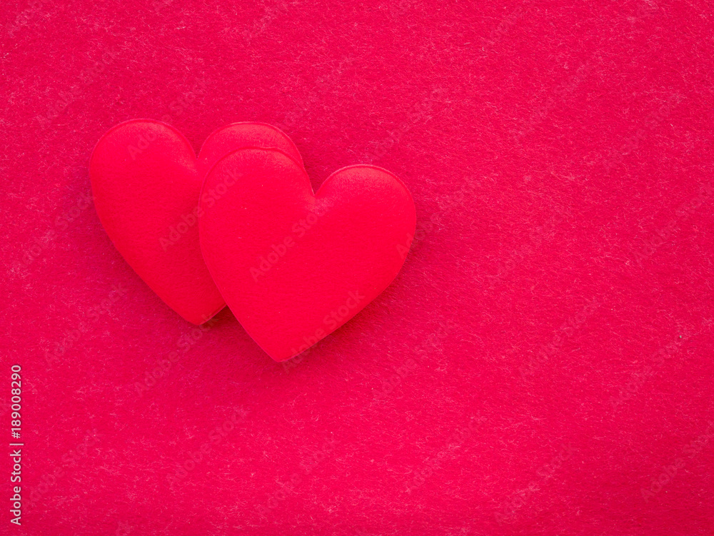 red heart on red paper texture background