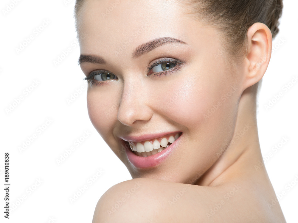 Young smiling woman with beautiful face.
