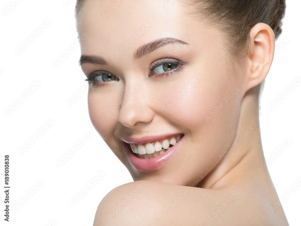 Obraz premium Young smiling woman with beautiful face.