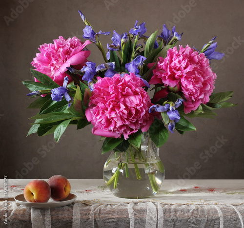 Still life with flowers and fruit.