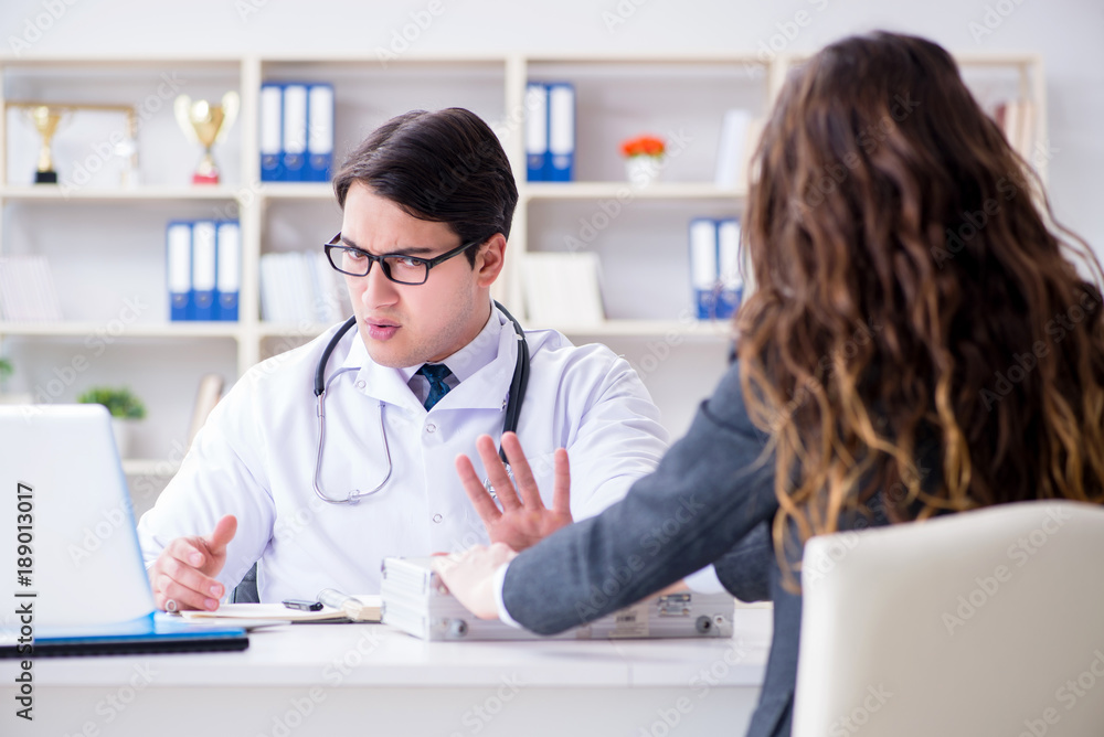 Young doctor in medical insurance fraud concept Young doctor in medical insurance fraud concept