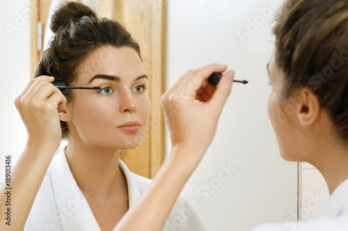 Woman applying tinted eyebrow gel