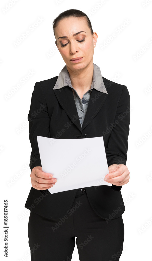 Sad woman reading a document Sad woman reading a document