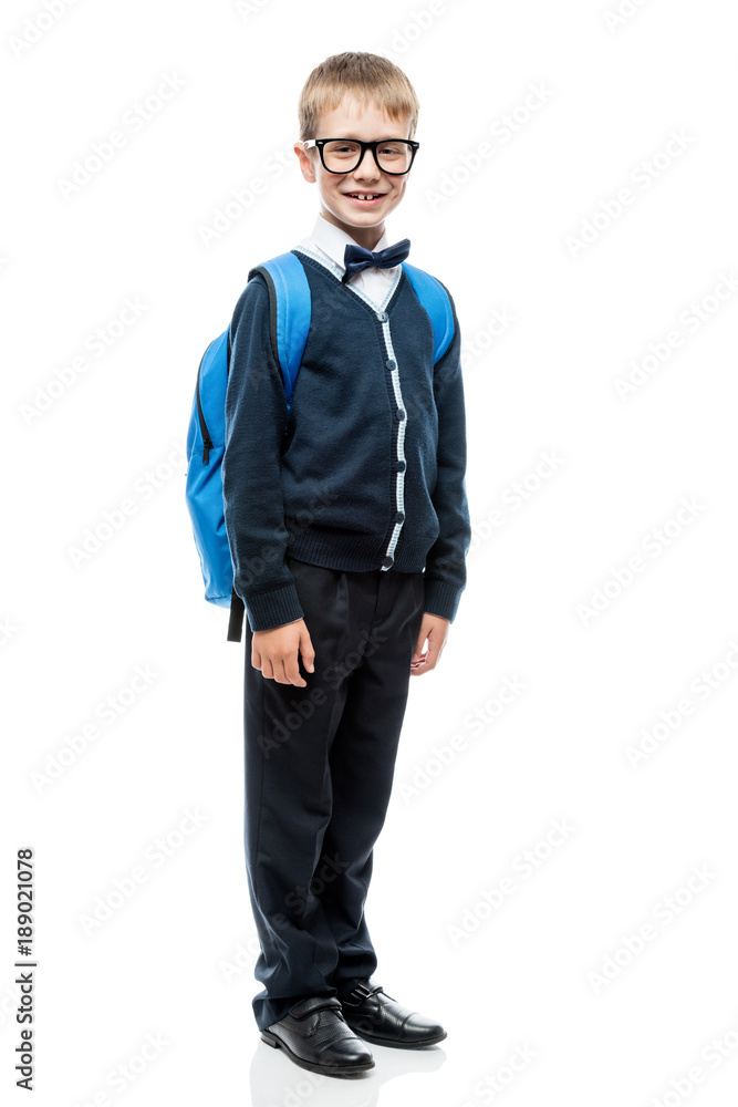 schoolboy in school uniform with a backpack in full length portrait isolated schoolboy in school uniform with a backpack in full length portrait isolated