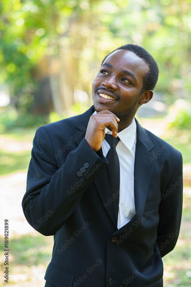 Thoughtful african american businessman thinking with smile and happy. Thoughtful african american businessman thinking with smile and happy.