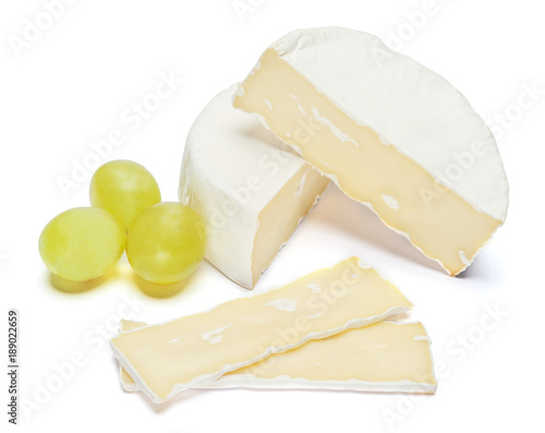 Piece of brie or camambert cheese on a white background photo