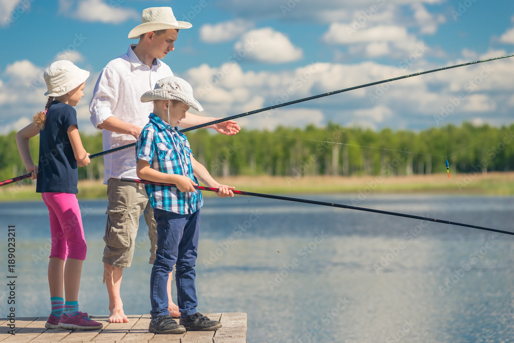 Dad with his daughter and son on a fishing weekend Dad with his daughter and son on a fishing weekend
