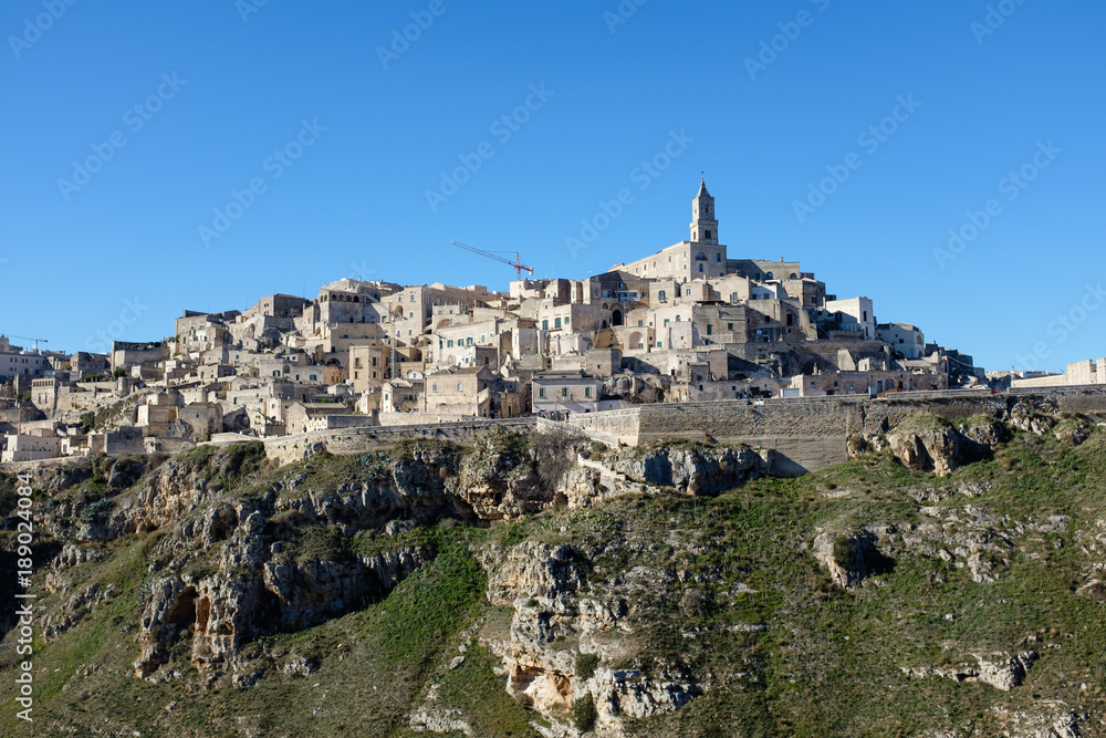 View from the bottom of the canyon of the old town of Matera. Italy