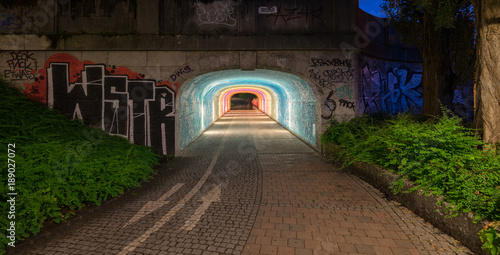 enlightened, clourful bike tunnel in Munich photo