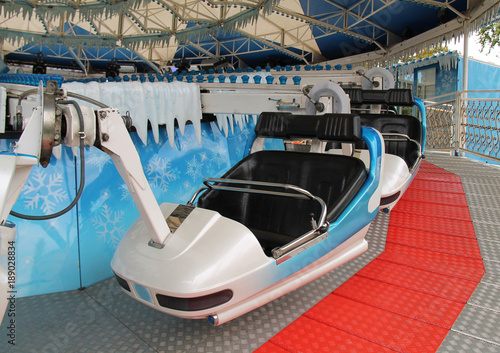 The Seats and Carriage of a Fast Spinning Fun Fair Ride.