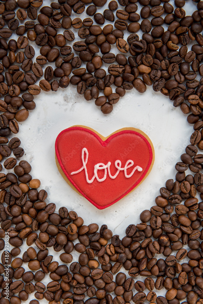 Cookie heart and frame heart from coffee beans top view Cookie heart and frame heart from coffee beans top view