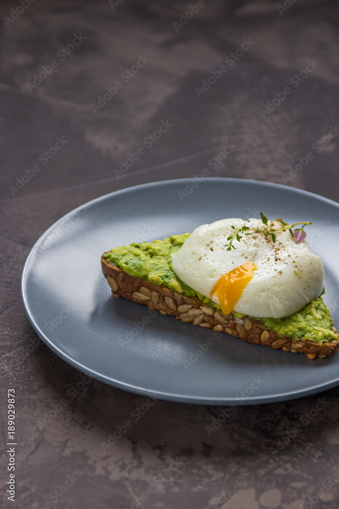Sandwich with avocado and poached egg. Healthy breakfast Sandwich with avocado and poached egg. Healthy breakfast