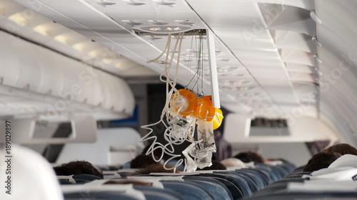 Oxygen Mask falling out in Airplane. photo