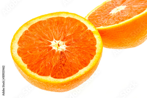 Close up of fresh sunkist orange isolated on white background