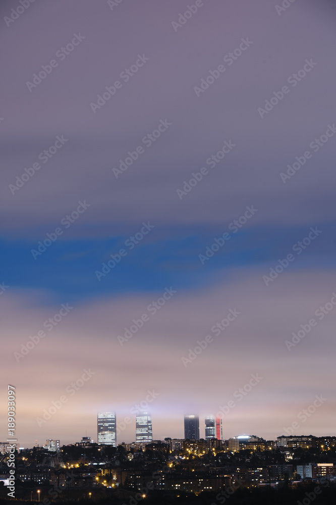 Overview of the four towers of Madrid with fog
