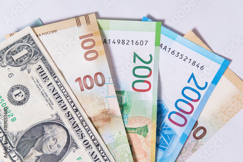 new Russian money banknotes and commemorative Olympic banknote with dollar on white background