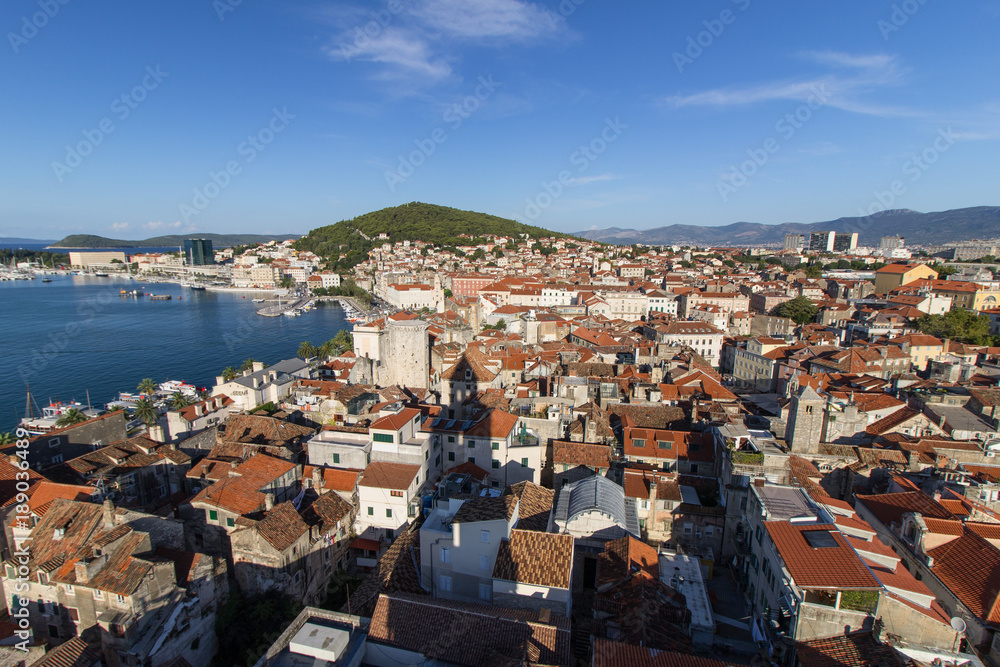 View of Split's historic Diocletian's Palace, Old Town and Marjan Hill from above in Croatia on a sunny day.
