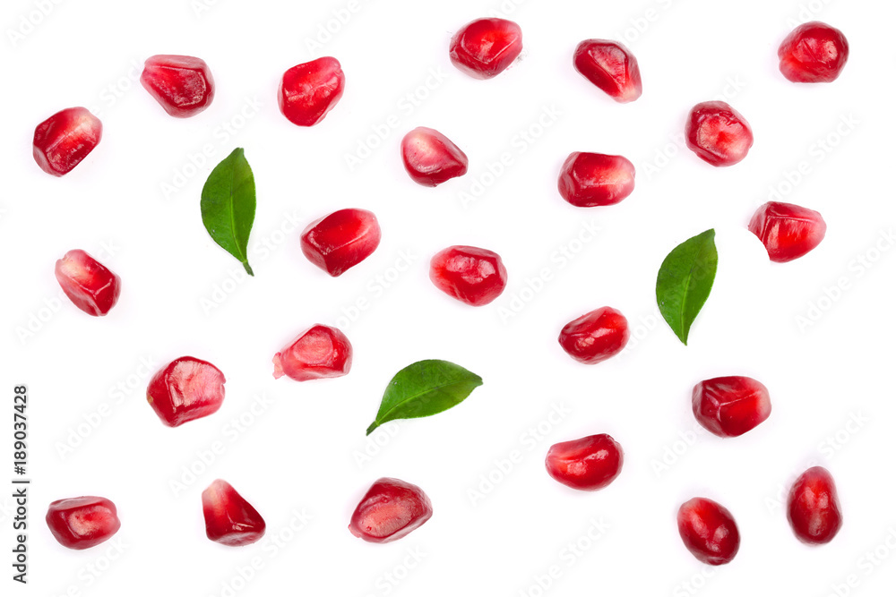 pomegranate seeds with leaves isolated on white background. Top view. Flat lay pattern pomegranate seeds with leaves isolated on white background. Top view. Flat lay pattern
