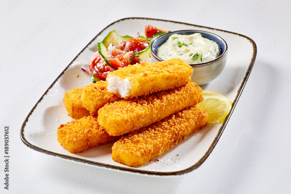 Close-up of fish fingers served with tartare sauce Close-up of fish fingers served with tartare sauce