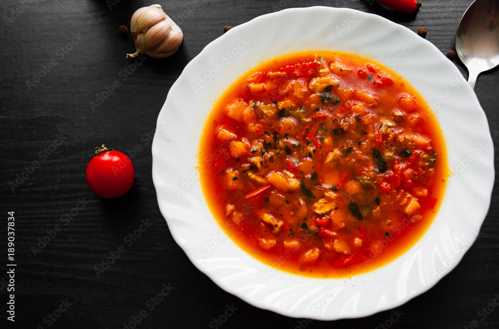 soup in plate on dark wooden background soup in plate on dark wooden background