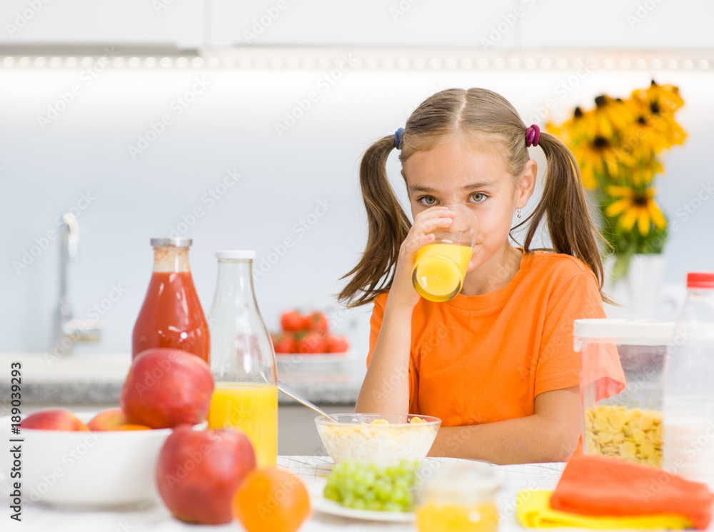 girl drinks orange juice for breakfast girl drinks orange juice for breakfast