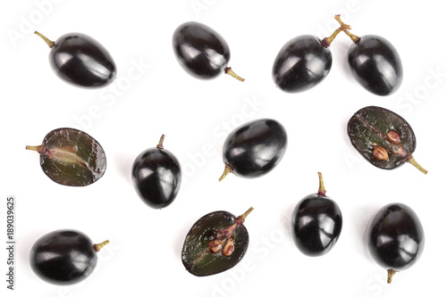 Dark grapes isolated on white background, top view. Flat lay