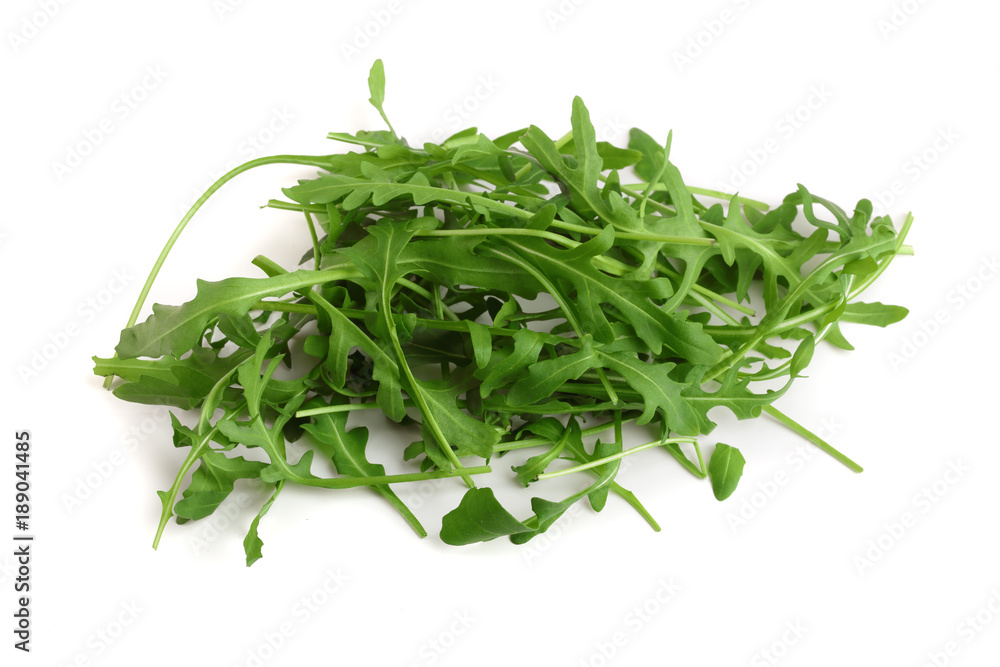 Heap of Green fresh rucola or arugula leaf isolated on white background Heap of Green fresh rucola or arugula leaf isolated on white background